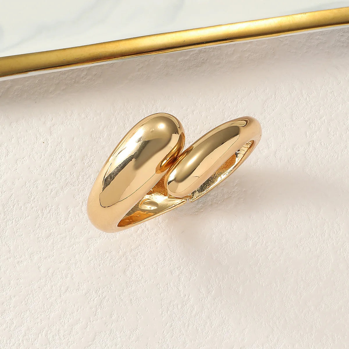 Zoira Twist Bracelet – A graceful gold bracelet with a delicate twisted design,