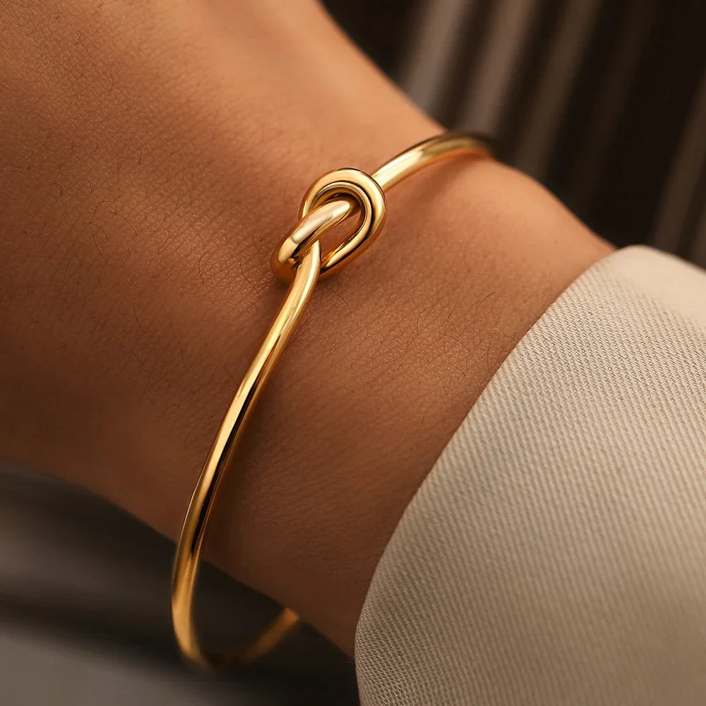 Elysian Cuff – A minimalist gold cuff with refined elegance.