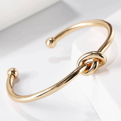 Elysian Cuff – A minimalist gold cuff with refined elegance.