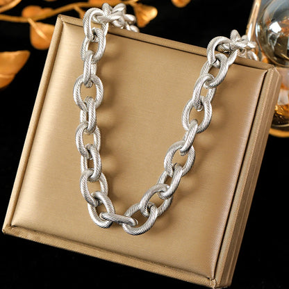 Zahara Twist Bracelet – A twisted gold bracelet exuding playful elegance.