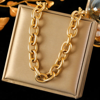 Zahara Twist Bracelet – A twisted gold bracelet exuding playful elegance.