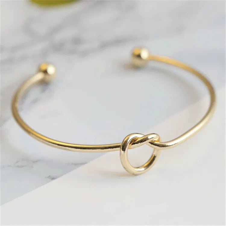 Elysian Cuff – A minimalist gold cuff with refined elegance.