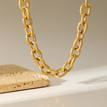 Zahara Twist Bracelet – A twisted gold bracelet exuding playful elegance.