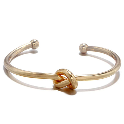 Elysian Cuff – A minimalist gold cuff with refined elegance.